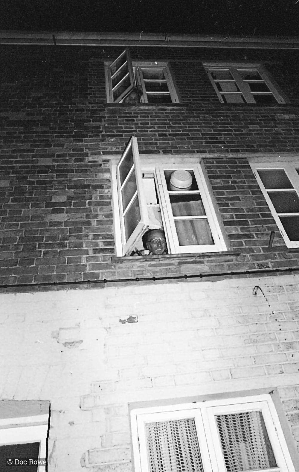 man singing from window