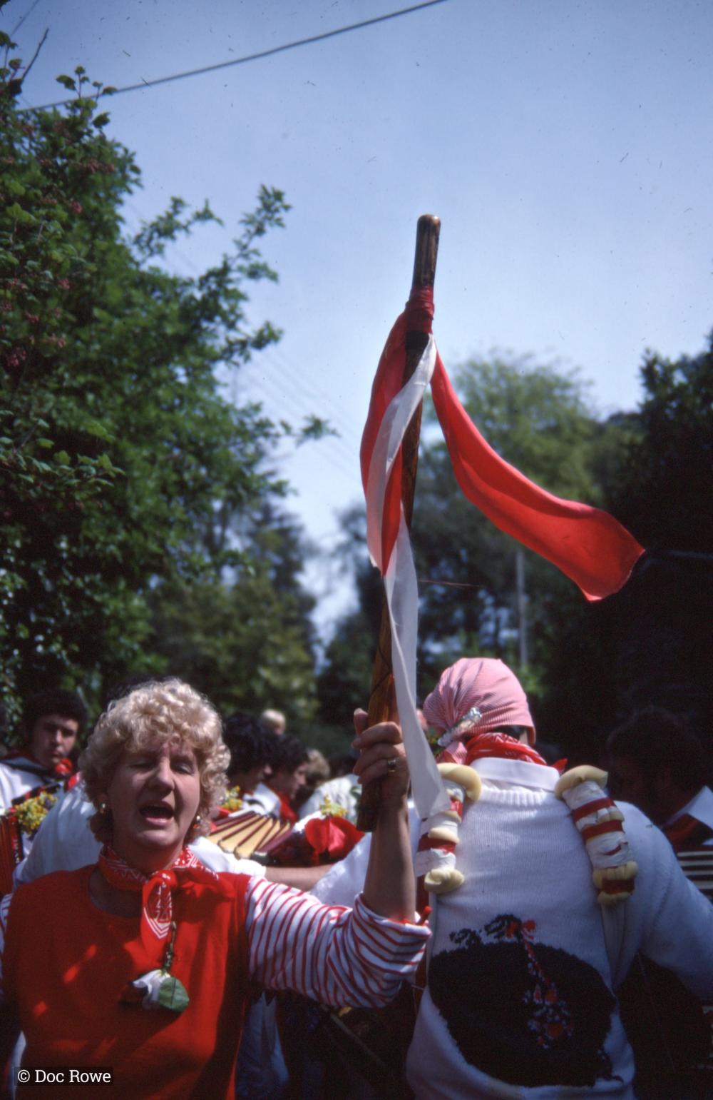 Woman holding Old Oss flag