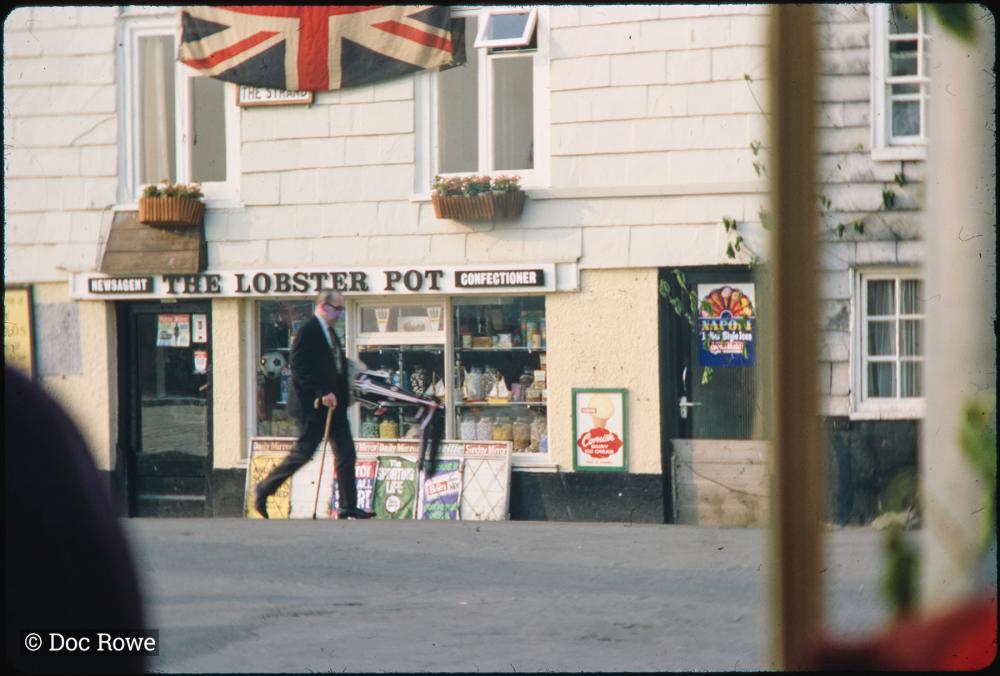 Early morning, man walking past The Strand