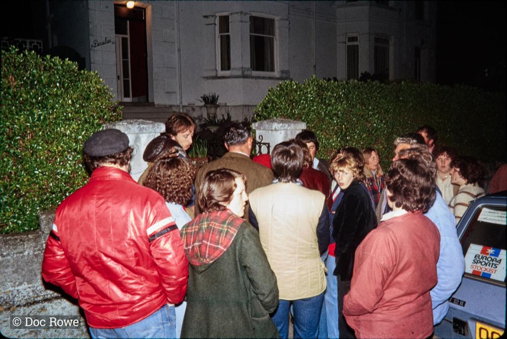 Night time, crowd gathered at gate