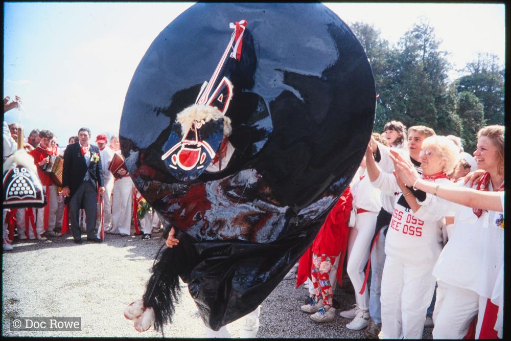 Old Oss dancing at Prideaux Place, women pushing it away