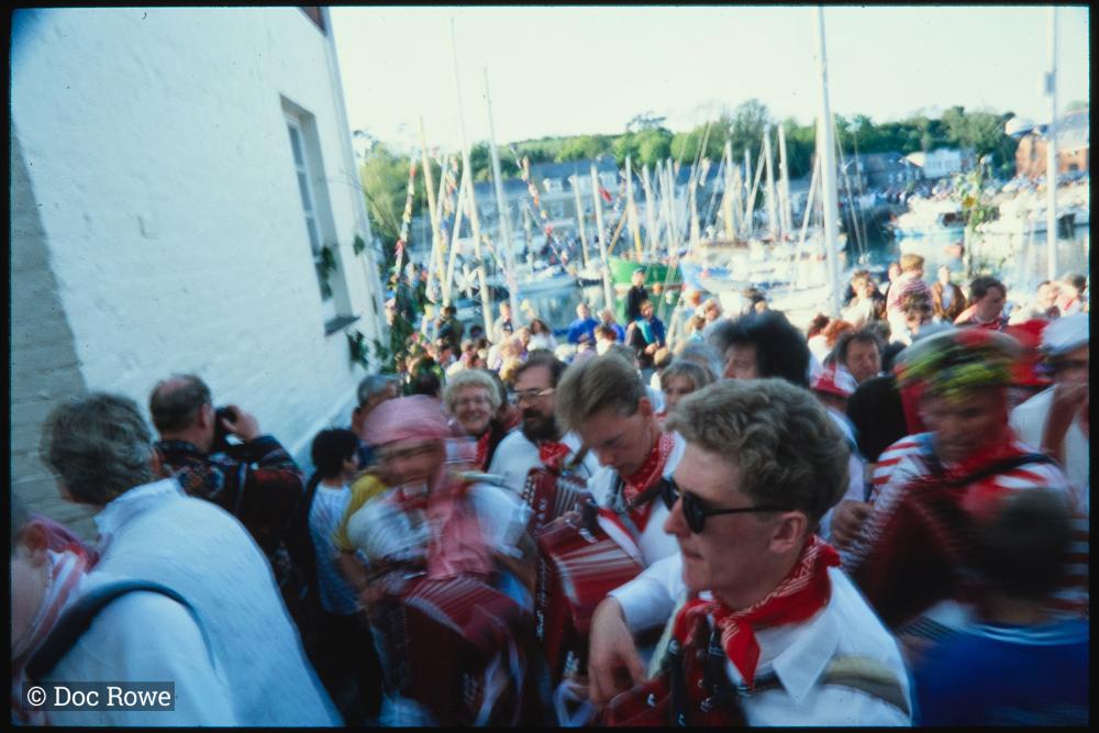Old Oss musicians in procession beside quay